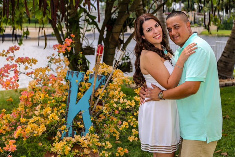 Color-corrected portrait of a couple by bright bougainvillea, by Arte City Media