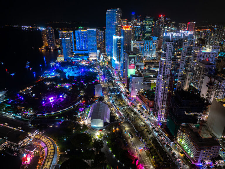 Downtown Miami lit up at night, by Arte City Media