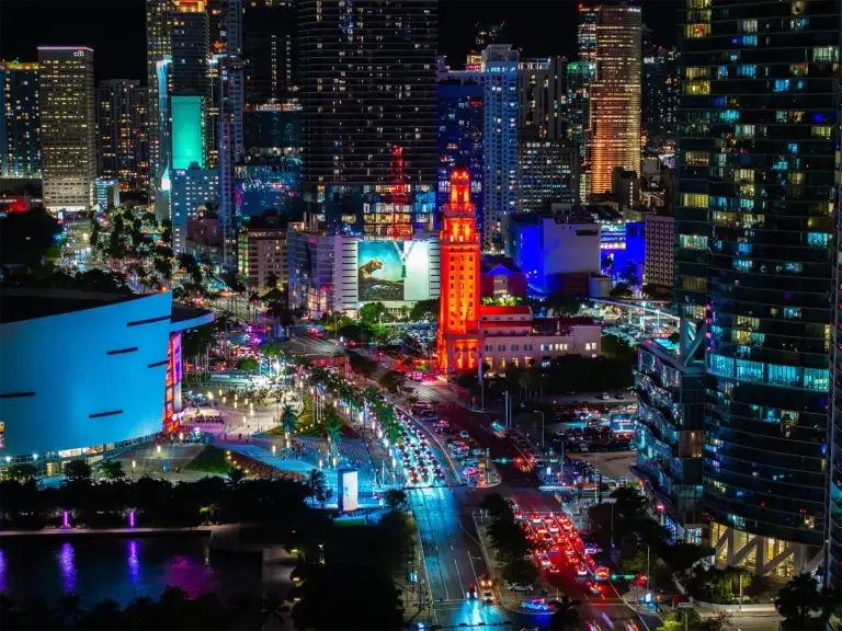 Downtown Miami at night with the Freedom Tower lit up, aerial by Arte City Media
