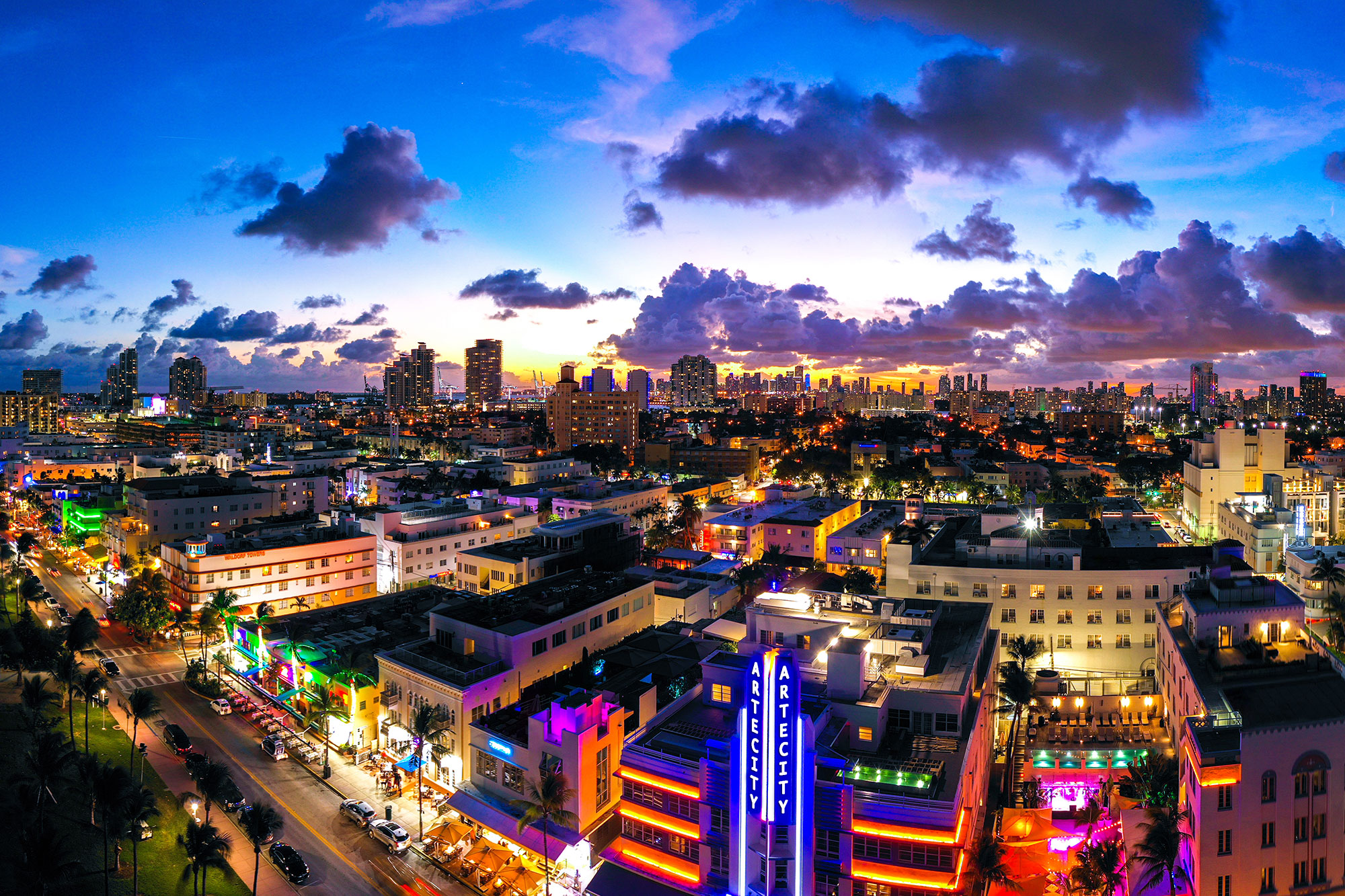 South Beach Ocean Drive at night with the ARTE CITY neon sign