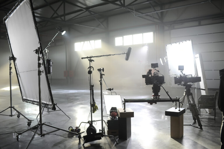 Black and white film studio set with lights and stands