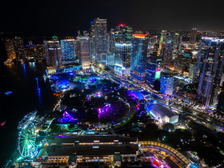 Aerial view of an outdoor concert lit up at night in Downtown Miami