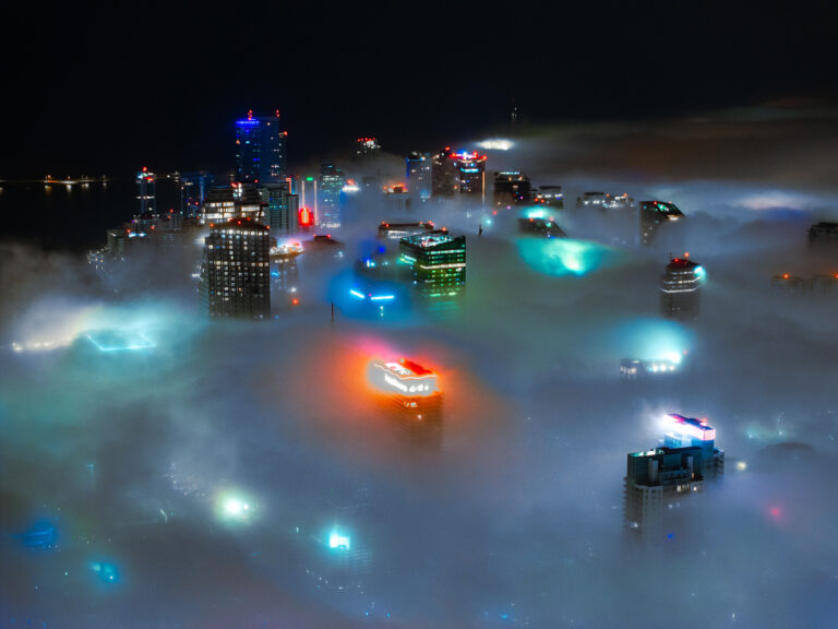 Downtown Miami towers rising above a layer of fog