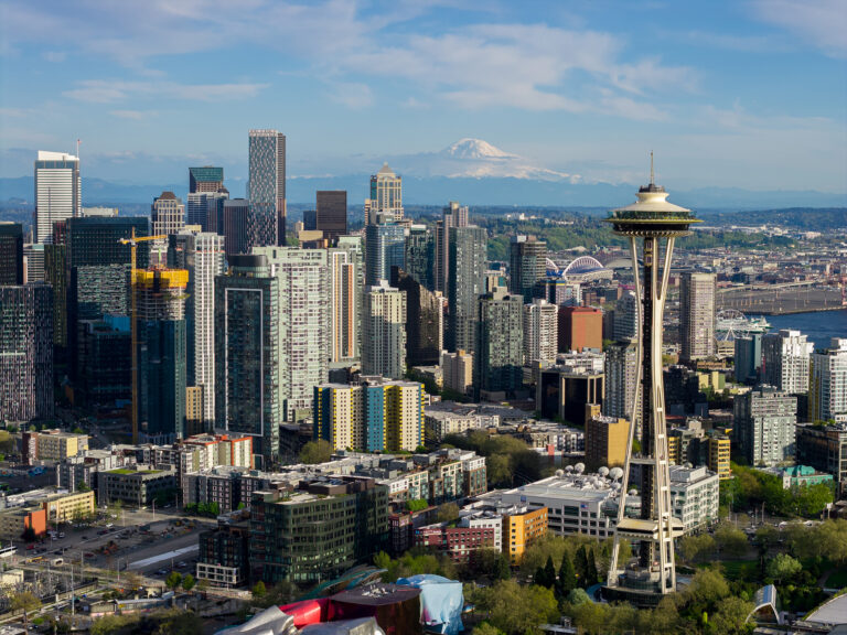 Daytime aerial view of the Seattle skyline and the Space Needle, by Arte City Media