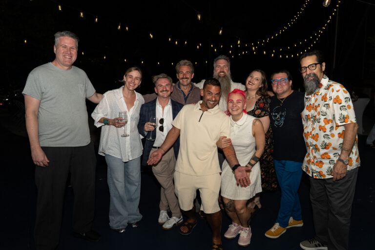 Family and friends gathered together at a night celebration, by Arte City Media