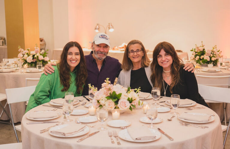 Family gathered at an elegant dinner table, by Arte City Media